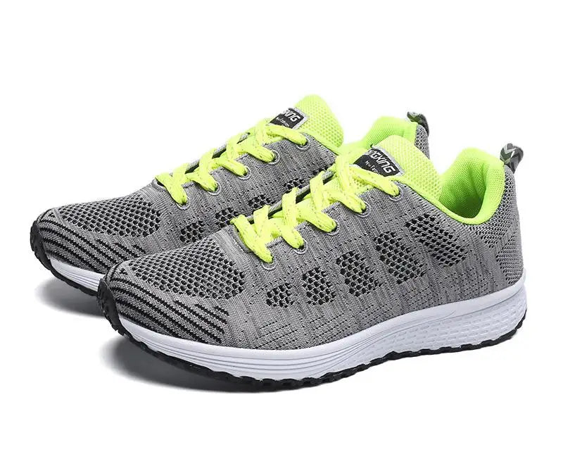 Women's breathable mesh sneakers by TrendLux Wear, lightweight flat walking shoes for gym and daily wear, shown in black with mesh design.