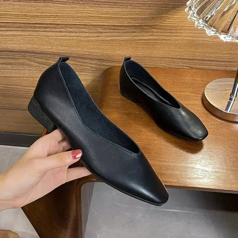 Women's round-toe leather loafer flats by TrendLux Wear, featuring sleek design and comfortable fit, shown on a white background.