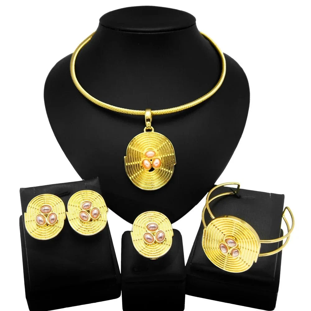 Women's gold plated jewellery set by TrendLux Wear featuring earrings and necklace with intricate designs.