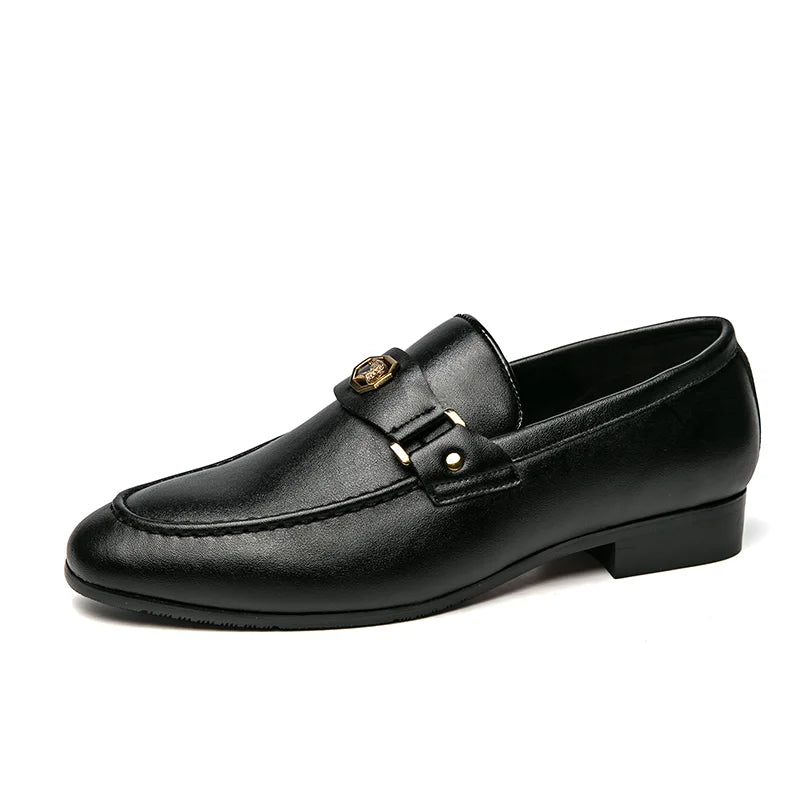 Elegant black leather loafers featuring a round toe, slip-on design, and metallic buckle detail.