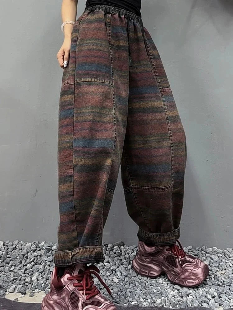Women’s Korean style striped harem jeans by TrendLux Wear with loose fit, elastic waist, and denim fabric, shown from front view.