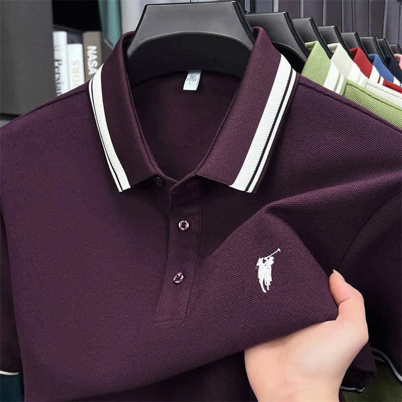 Dark purple short sleeve polo shirt with white-striped collar and pony embroidery detail. Made of 100% cotton.