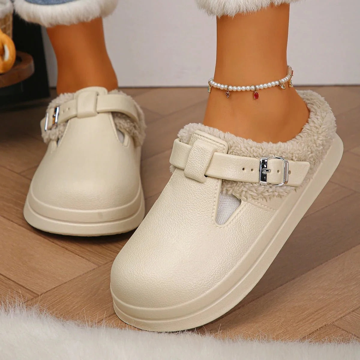 Women's waterproof furry mule slippers by TrendLux Wear with plush lining, metal buckle, and non-slip indoor EVA soles.
