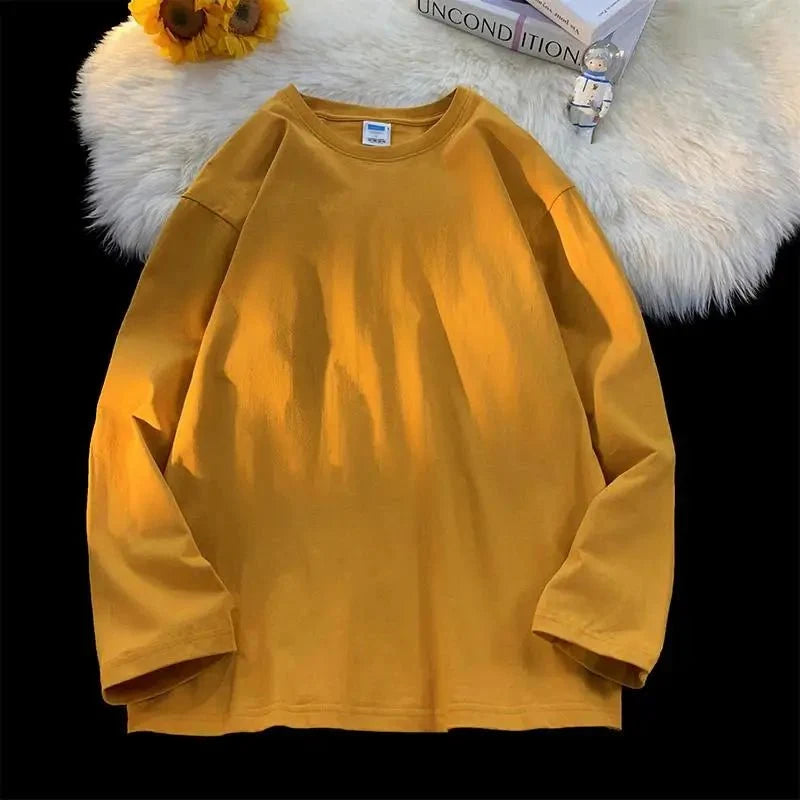 Unisex oversized long sleeve blank T-shirt by My Store 5, showing a plain white shirt with a relaxed fit and long sleeves.