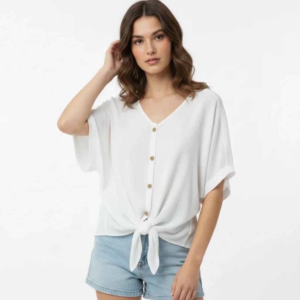 White women's flowy blouse by C'est Elle, elegant casual loose-fit top with soft fabric and relaxed fit, perfect for stylish everyday wear.