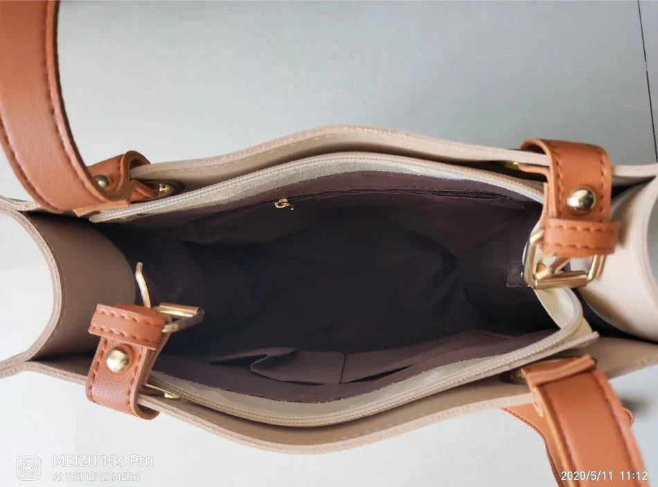 Large women's designer leather handbag by TrendLux Wear, featuring sleek pure leather construction and spacious interior.