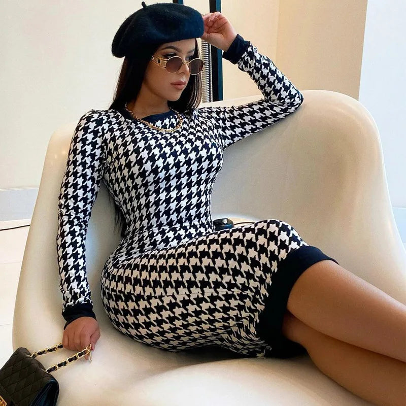 Houndstooth print long sleeve midi dress in black and white, slim fit, with hollow out design and knee-length.