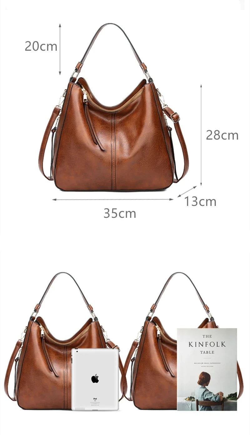 Brown faux leather hobo bag with single shoulder strap, decorative zipper, and spacious interior pockets.