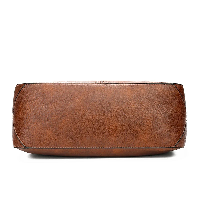 Brown faux leather hobo handbag featuring a single strap, a smooth exterior, and a zip closure.