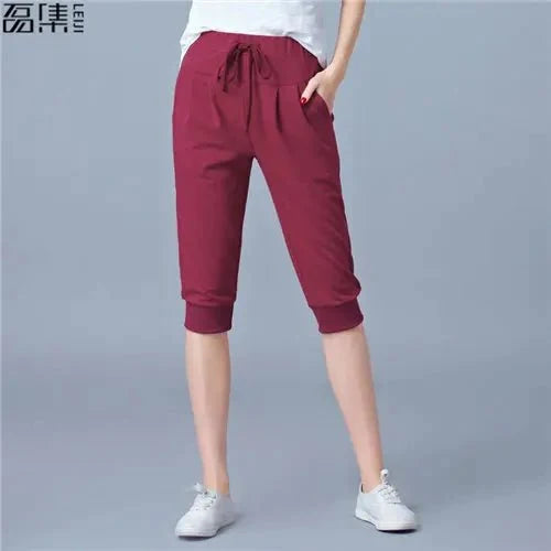 Women's high waist harem jogger capri pants by TrendLux Wear featuring loose, comfortable sweatpants with a stylish relaxed fit.