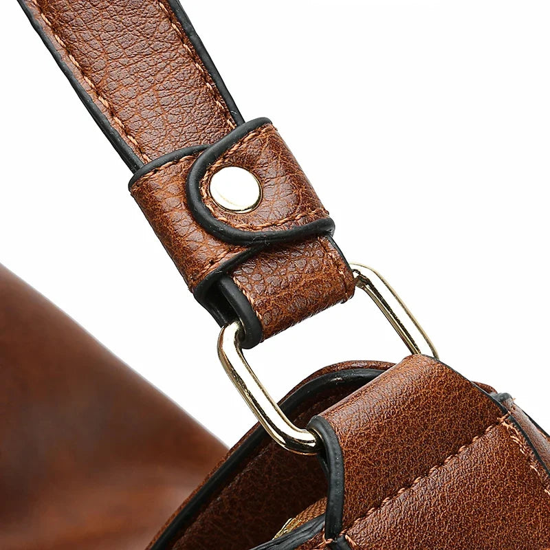 Brown faux leather handbag featuring a thick strap with gold hardware and a textured finish.