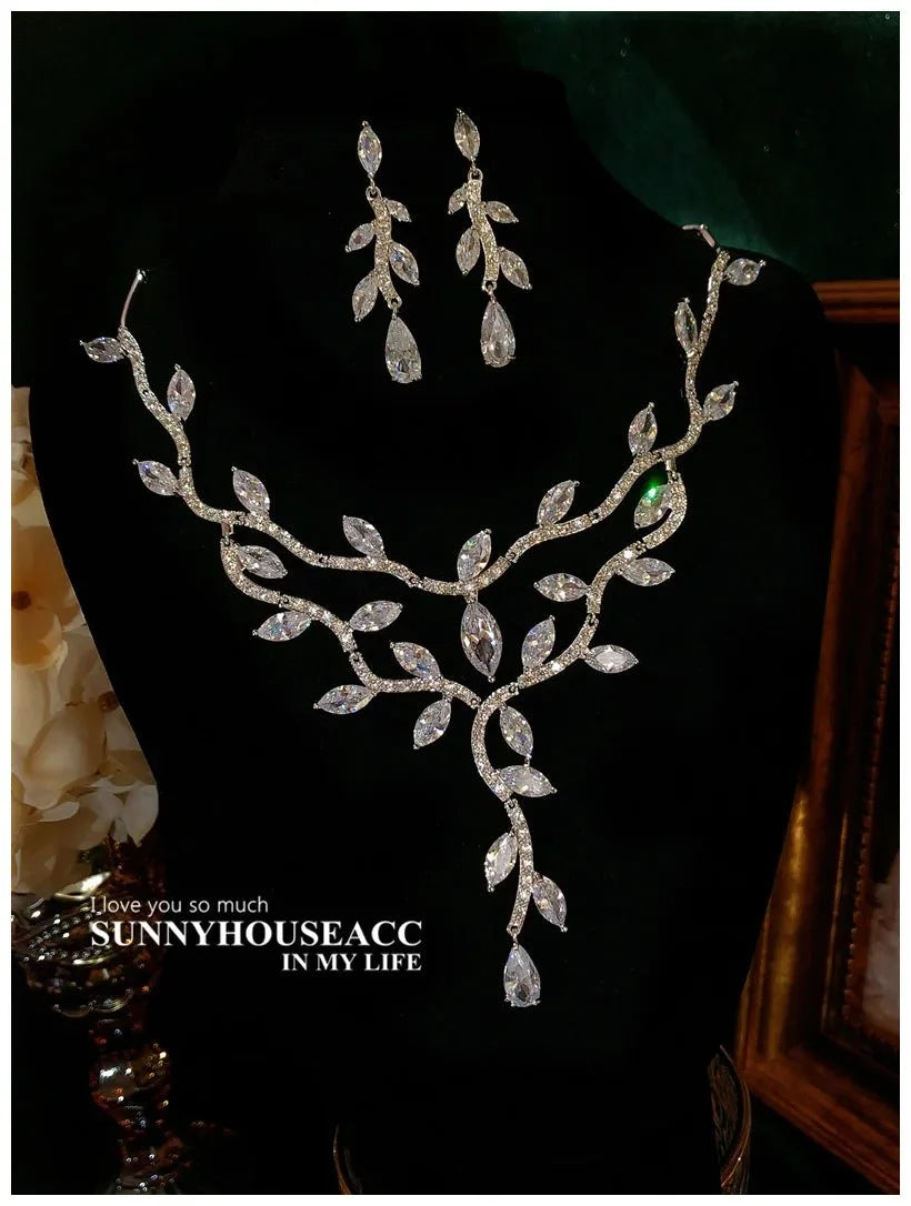 Sterling silver floral jewelry set for women by TrendLux Wear, featuring intricate flower designs and elegant craftsmanship.