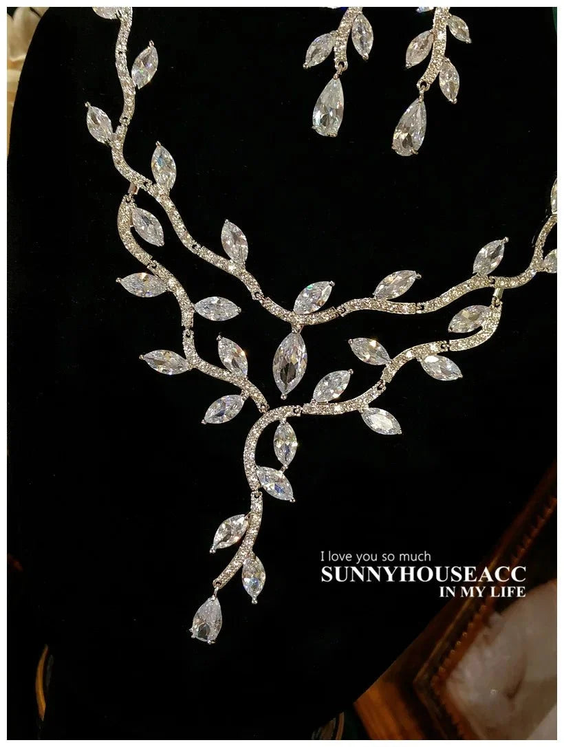 Sterling silver floral jewelry set for women by TrendLux Wear, featuring elegant flower-shaped necklace and earrings.