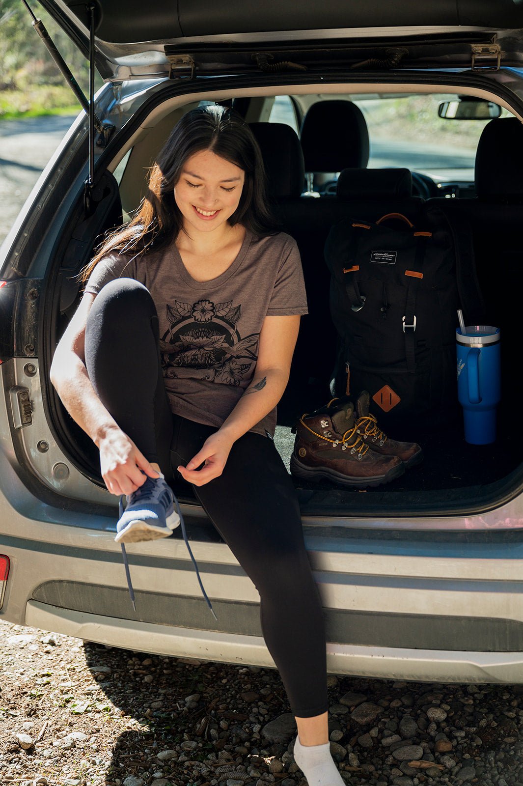 Women's eco T-shirt by KINDRED COAST featuring hummingbird graphic, soft fabric, and casual fit in natural light.