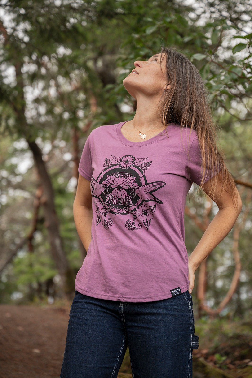 Women's eco-friendly T-shirt from KINDRED COAST featuring hummingbird artwork, soft fabric, and sustainable design.