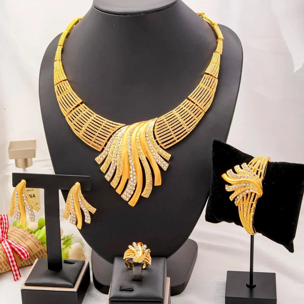 Dubai 24K gold luxury jewelry set by TrendLux Wear, featuring elegant statement pieces with intricate gold detailing.