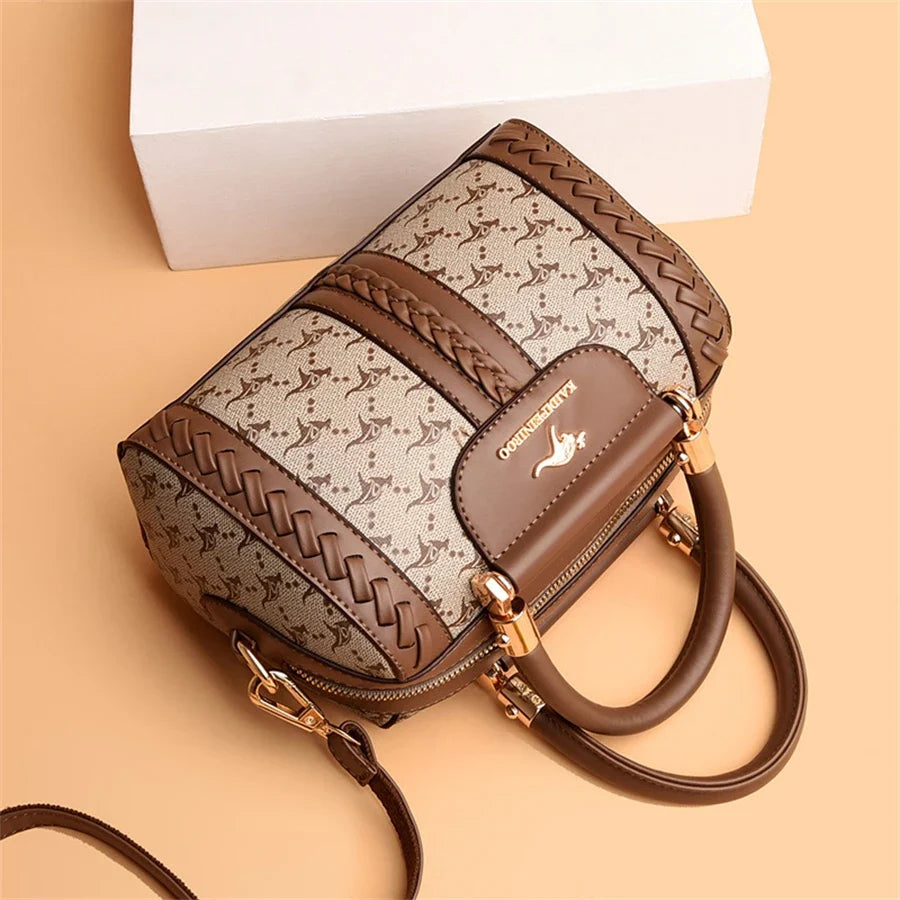 Designer shoulder handbag featuring a semi-woven pattern in brown and beige, with braided details and a gold zipper.
