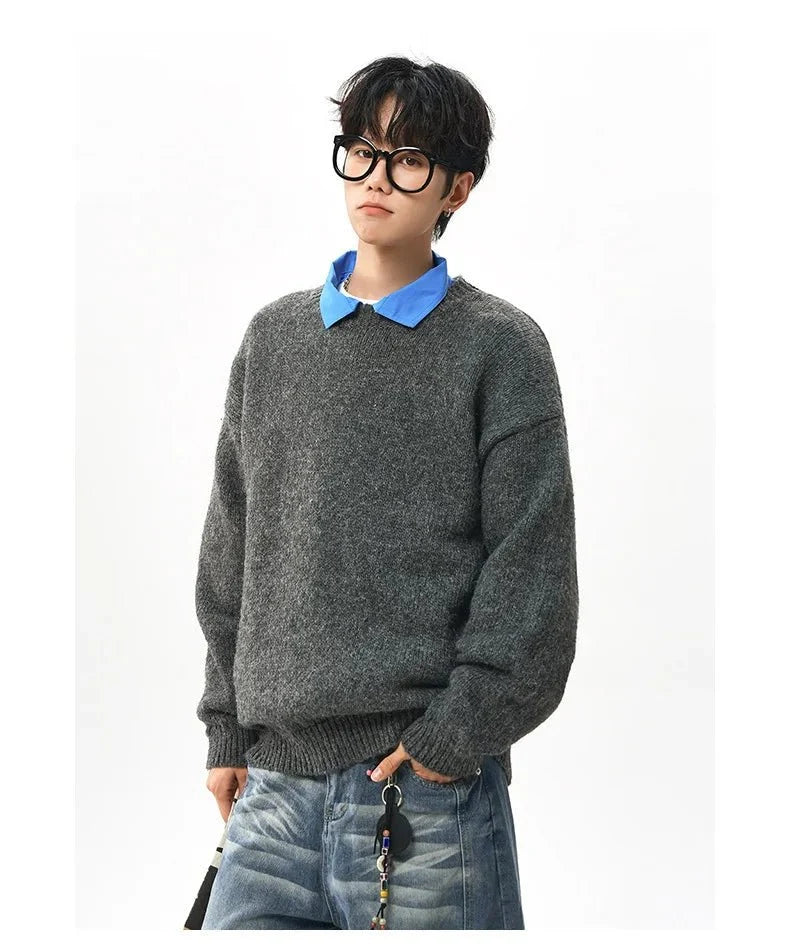 Men's oversized round neck pullover sweater by TrendLux Wear in warm polyester knit, available in three colors.