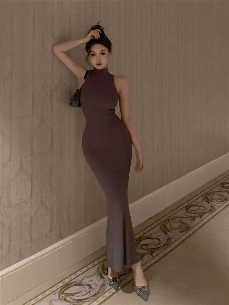 Women's knit turtleneck bodycon ankle-length maxi dress by The Glow Sanctuary, featuring a fitted silhouette and soft fabric in the image.