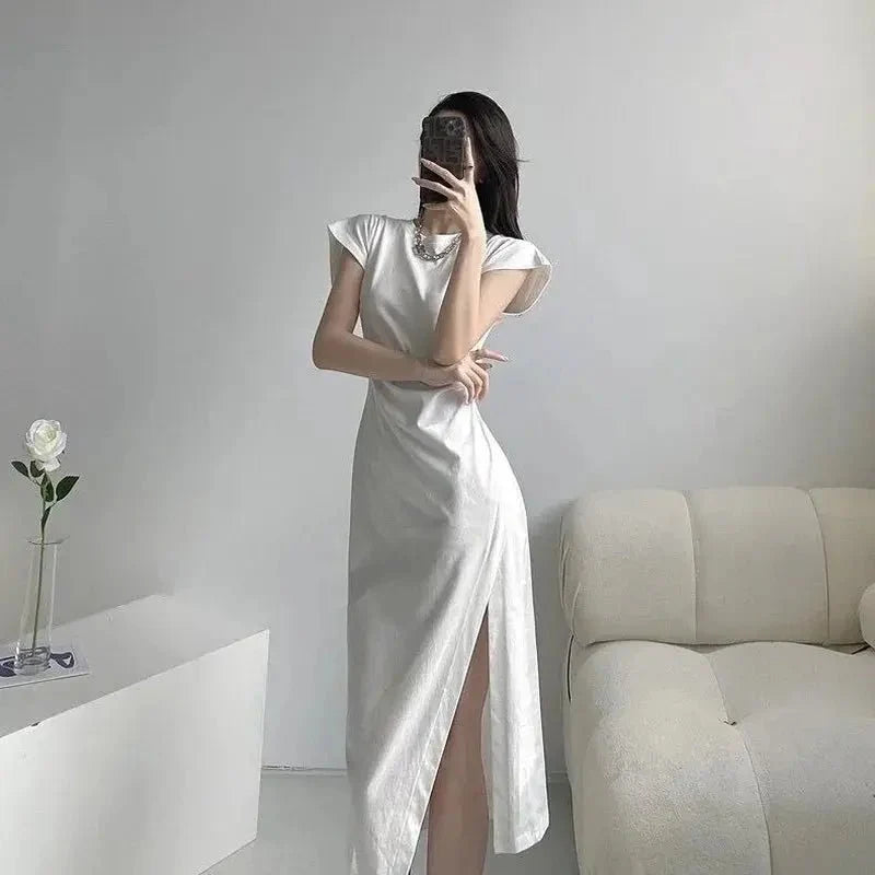Y2K asymmetrical hem midi dress by The Glow Sanctuary featuring a stylish streetwear-inspired design with a flowy silhouette.