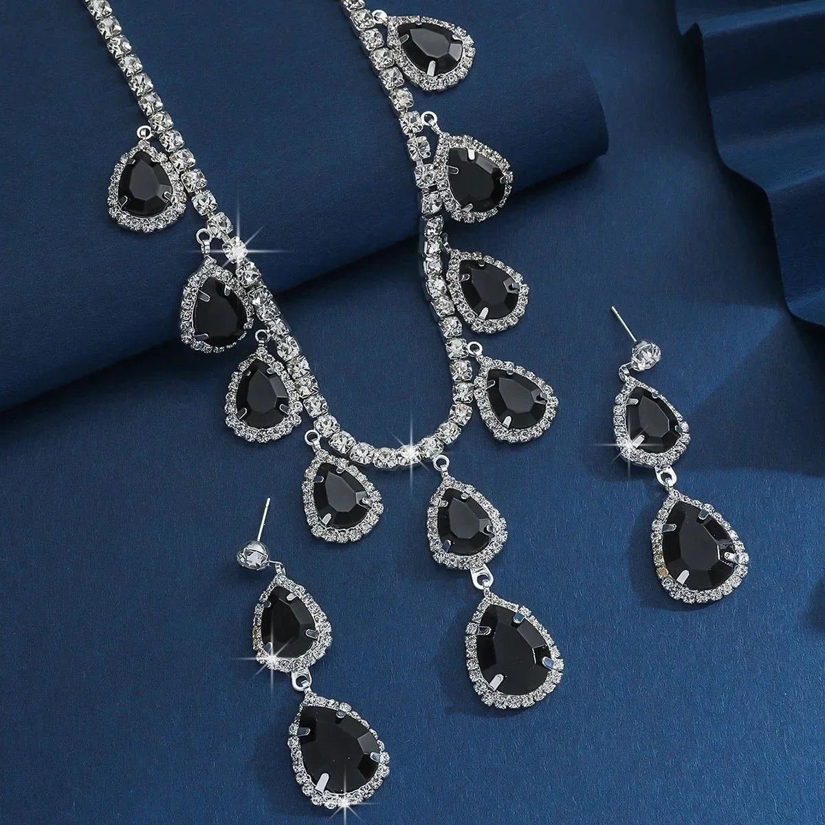 Women’s crystal pendant necklace and dangle earrings jewelry set by TrendLux Wear, featuring sparkling crystal accents and elegant design.