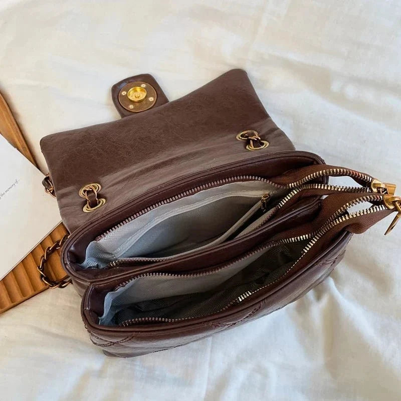 Women's luxury leather handbag with Lingge pattern from TrendLux Wear, featuring elegant design and pure leather construction.