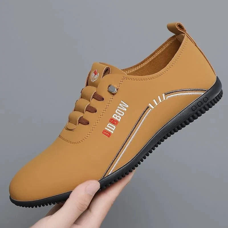Men's soft sole leather loafers by TrendLux Wear, lightweight slip-on moccasin walking shoes, shown in a close-up side view.