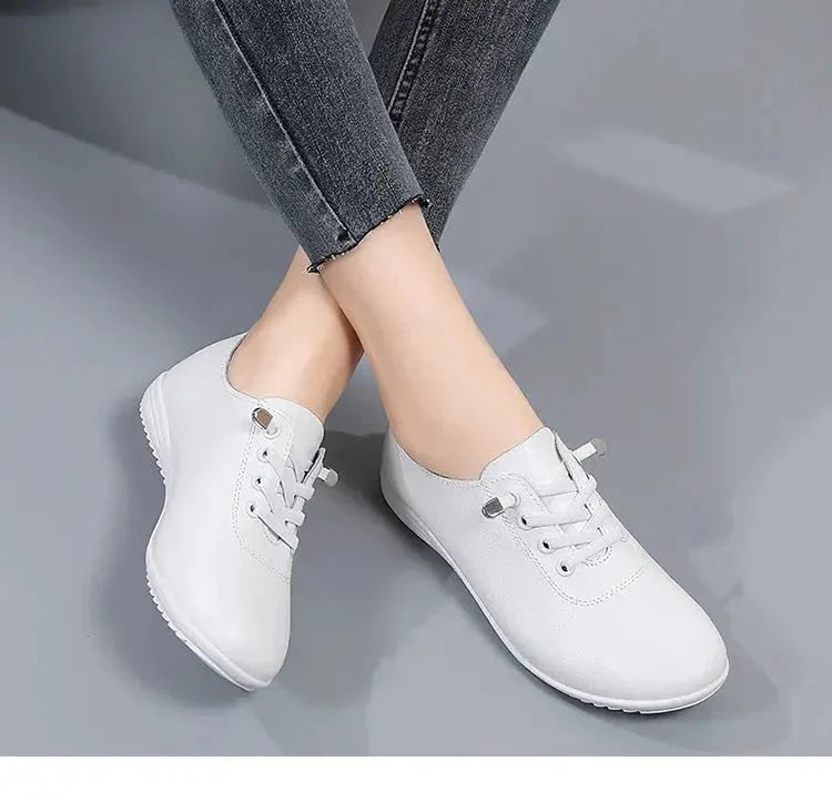 Women's lace-up leather loafers by TrendLux Wear, showcasing stylish black shoes with sleek design and comfortable fit.
