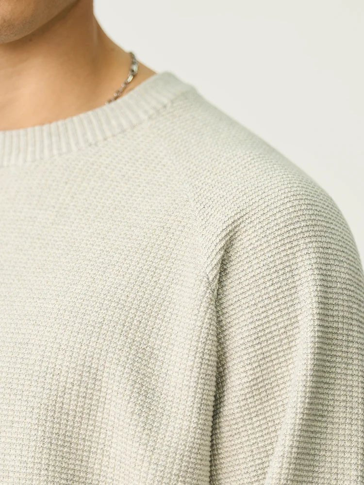 Men's oversized waffle-knit crewneck sweater in Heather Denim Blue by TrendLux Wear, casual pullover with textured knit fabric.