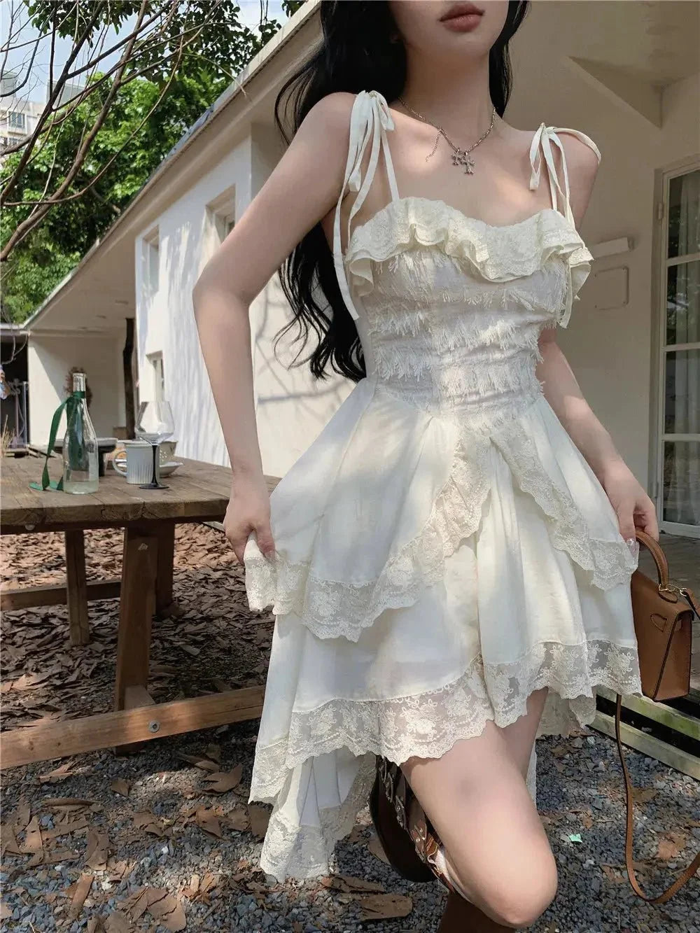 Women's polyester-cotton lace ruffle off-shoulder sling midi dress by The Glow Sanctuary, featuring a stylish and feminine design.