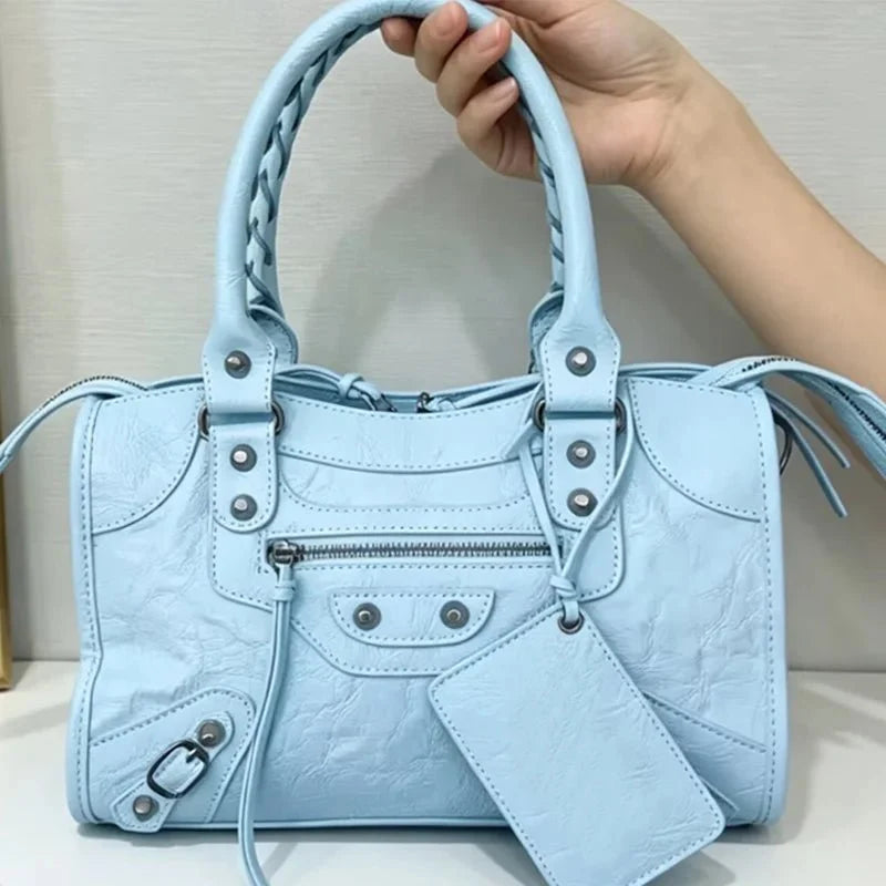 TrendLux Wear women's motorcycle hobo handbag with high capacity and luxurious leather design, featuring sturdy handles and spacious interior.