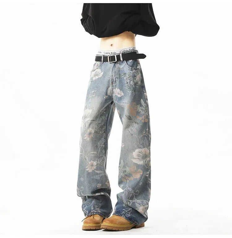 Men's retro floral print jeans by TrendLux Wear featuring loose wide-leg denim for casual, hip-hop style.