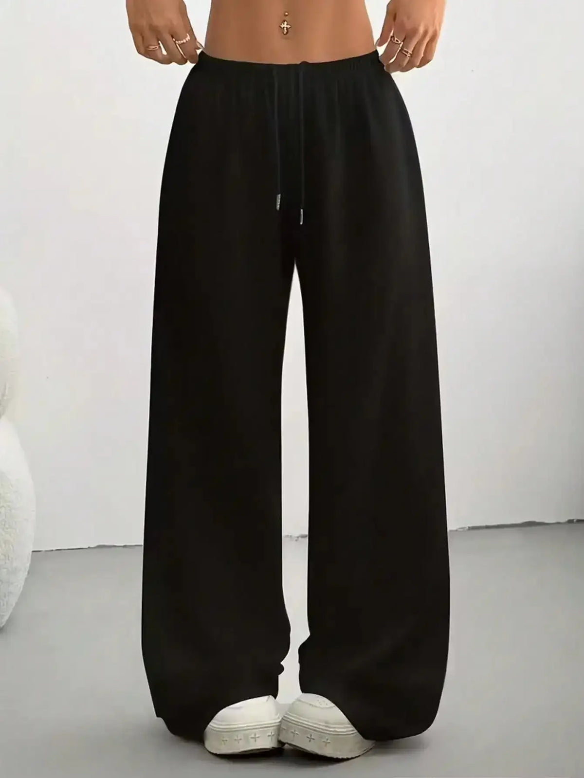 Ladies' casual wide-leg jogging pants by TrendLux Wear, featuring a relaxed fit and comfortable fabric in a neutral color.