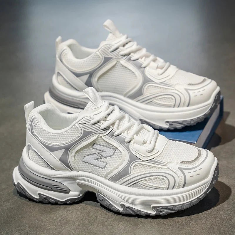 Men's chunky dad sneakers by TrendLux Wear with mesh and leather upper in beige, gray, and silver, showcasing a rugged sole and stylish design.