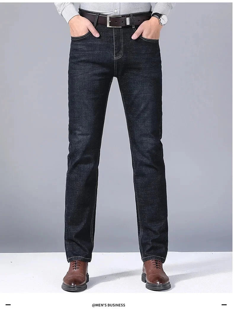 Men's slim fit black biker jeans by TrendLux Wear with straight leg style, size 32, shown on a model.