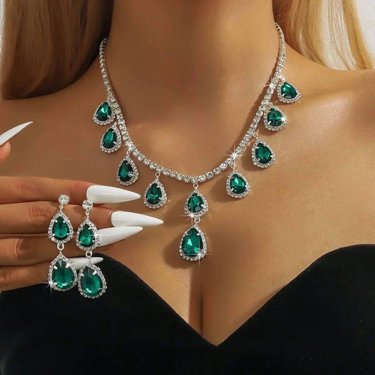 Women’s crystal pendant necklace and dangle earrings set by TrendLux Wear, featuring sparkling crystal jewelry on a white background.