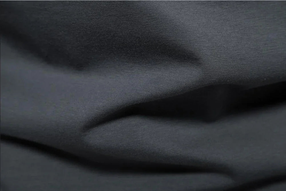 Men's slim fit Henley T-shirt by TrendLux Wear in black, white, or grey, featuring moisture-wicking, breathable fabric.