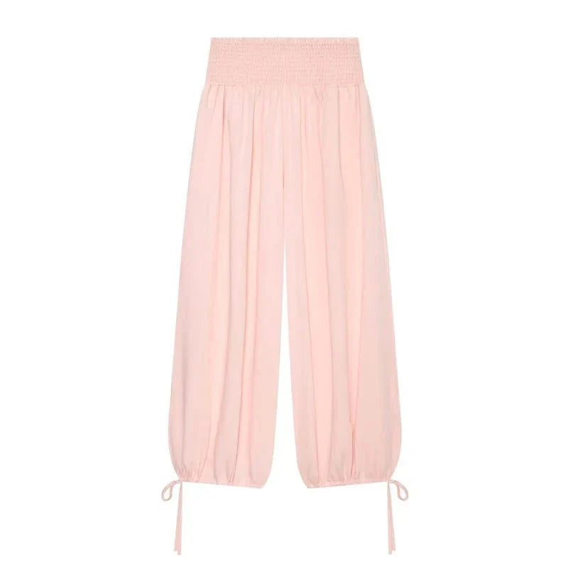 Women's pink high waist wide leg balloon pants by TrendLux Wear, showing the flowy, relaxed fit and stylish design.