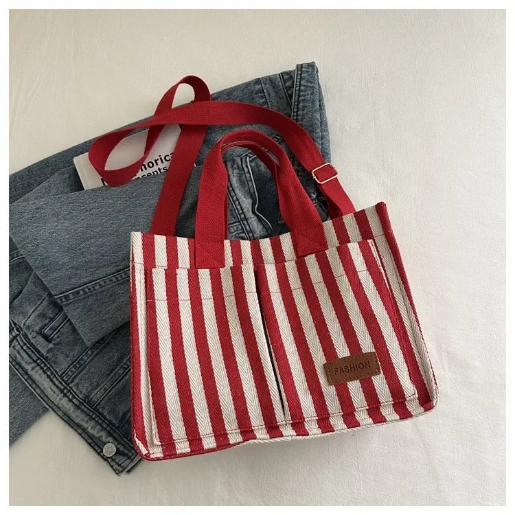 Large striped women's shoulder handbag by TrendLux Wear, featuring spacious design and stylish color pattern.