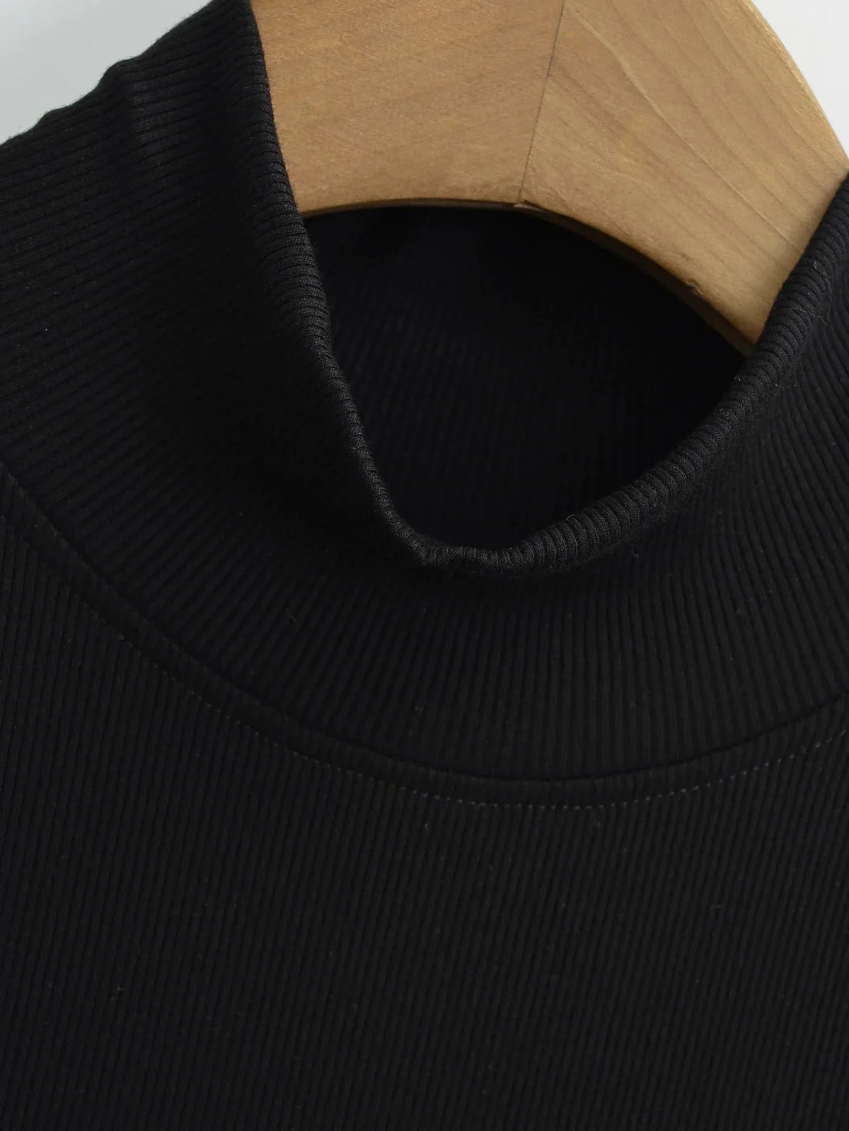 Women's knit turtleneck bodycon maxi dress by The Glow Sanctuary, featuring a fitted silhouette and ankle-length design.