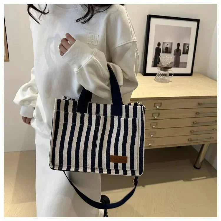 Large striped shoulder handbag for women by TrendLux Wear, showcasing spacious interior and stylish design.