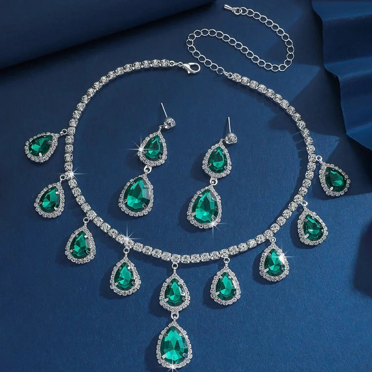 Elegant women's jewelry set featuring crystal pendant necklace and matching dangle earrings by TrendLux Wear.