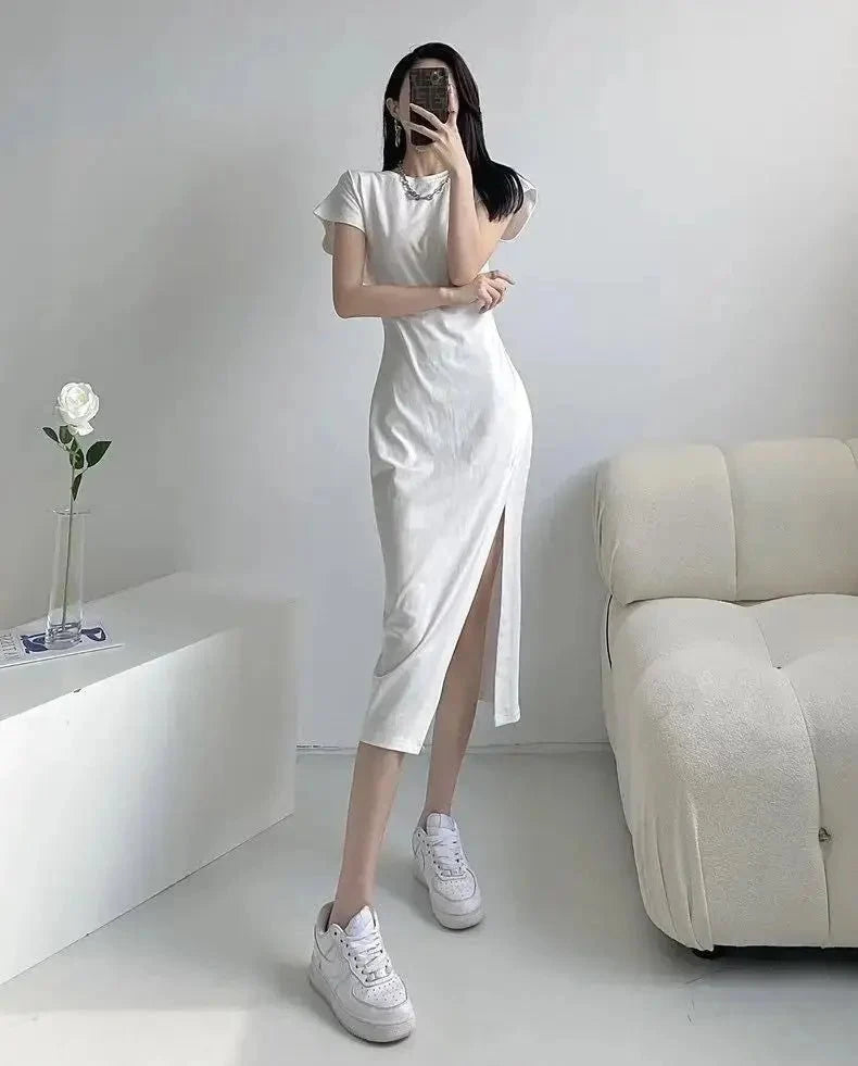 Y2K asymmetrical hem midi dress by The Glow Sanctuary featuring a stylish streetwear-inspired design and a flowing silhouette.