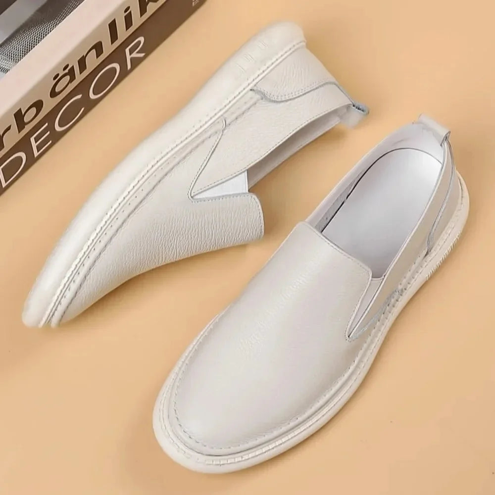 Men's genuine leather casual loafers by TrendLux Wear, breathable slip-on flat shoes in a solid color, showcasing a stylish, comfortable design.