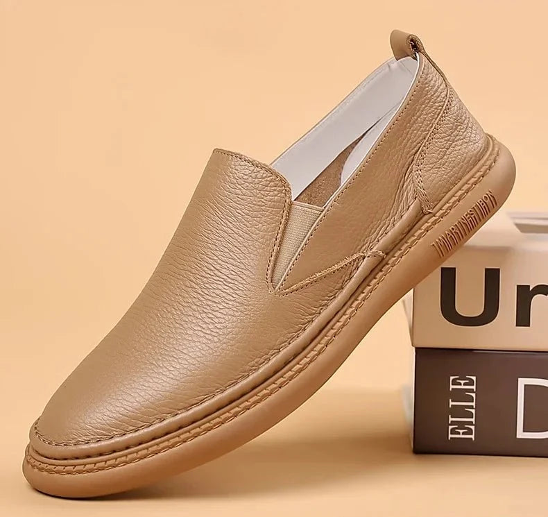 Men's genuine leather casual loafers by TrendLux Wear, slip-on flat shoes in solid color with breathable design and sleek style.