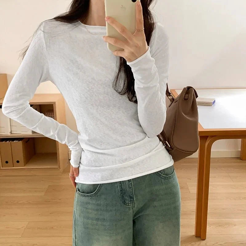Solid black slim-fit long sleeve T-shirt for women by TrenLux Wear, featuring an O-neck design and casual streetwear style.