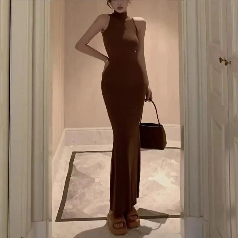 Women's knit turtleneck bodycon maxi dress by The Glow Sanctuary, ankle-length with a fitted silhouette and cozy knit fabric.