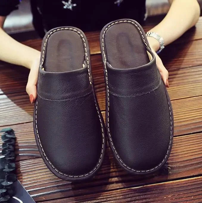 Unisex leather indoor slippers with non-slip soles from TrendLux Wear, EU sizes 35–46, featuring a comfortable house slide design.