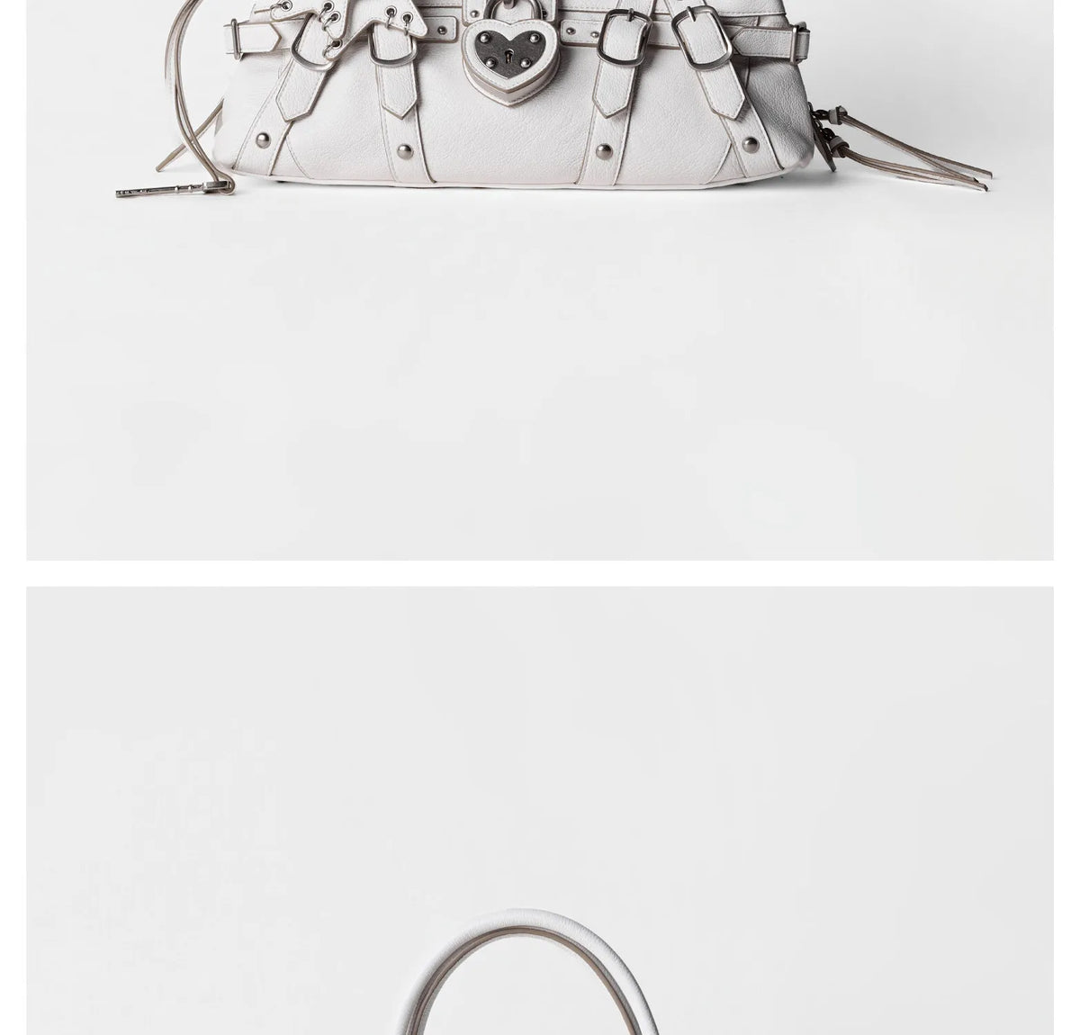 Rivet-embellished light gray microfiber handbag with a heart-shaped lock, featuring a single shoulder strap.