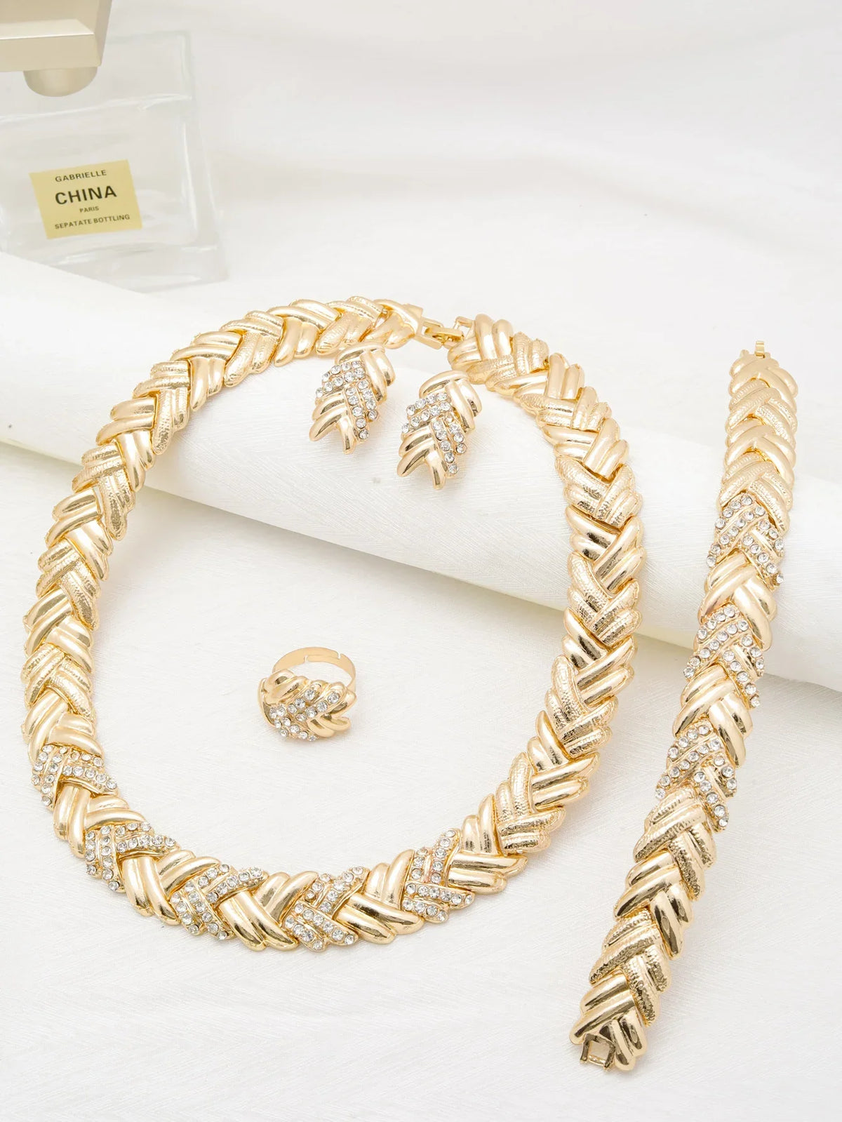 Women's Dubai 18K gold plated luxury jewelry set featuring elegant necklace, earrings, and bracelet by TrendLux Wear.